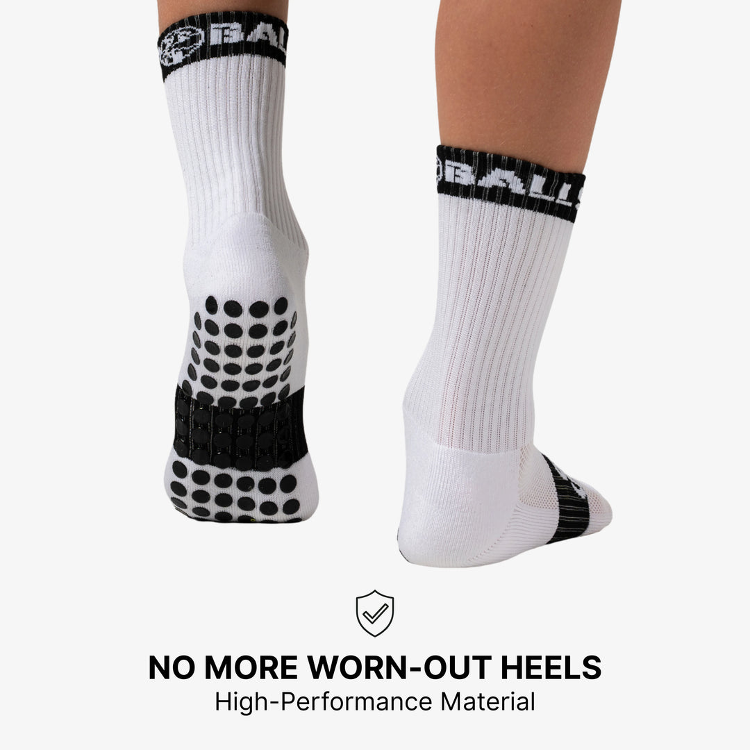 A visual emphasizing the benefit of grip socks in preventing worn out heels, possibly showing a close-up of a sock's heel area or a foot protected by the sock