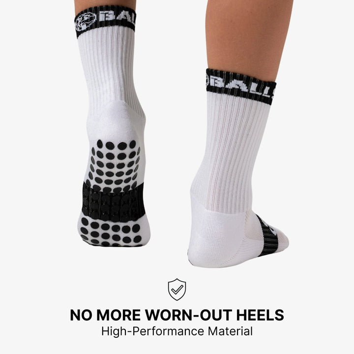 A visual emphasizing the benefit of grip socks in preventing worn out heels, possibly showing a close-up of a sock's heel area or a foot protected by the sock