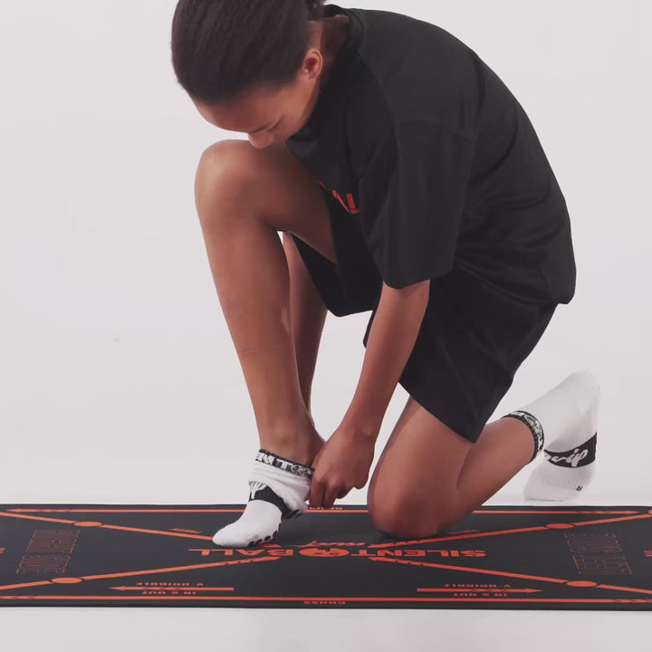 A video showcasing SilentBall grip socks, highlighting their non-slip features and how they enhance stability and performance during basketball training